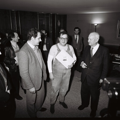 Pierre PFLIMLIN - EP President meets with French Comedian Coluche at the European Parliament in Strasbourg in February 1986