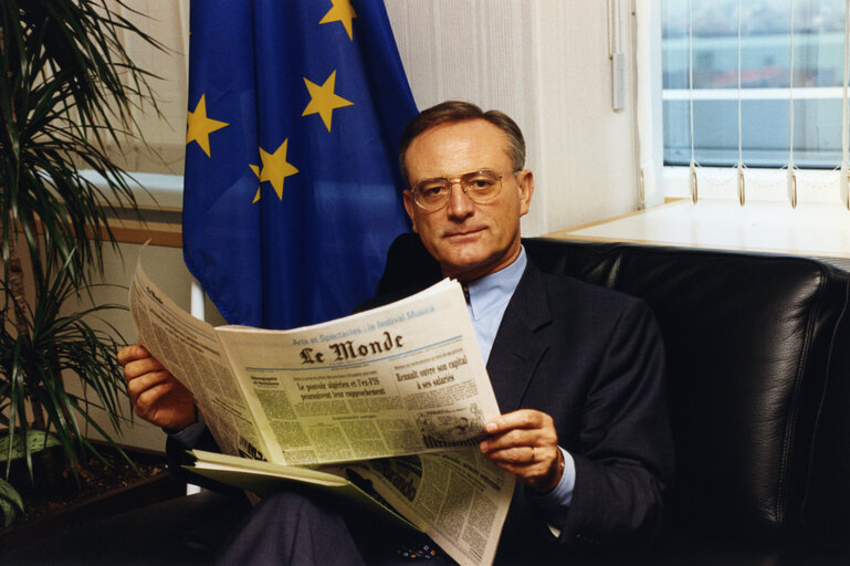 Photo 11: EP President reading his newspaper in his office.