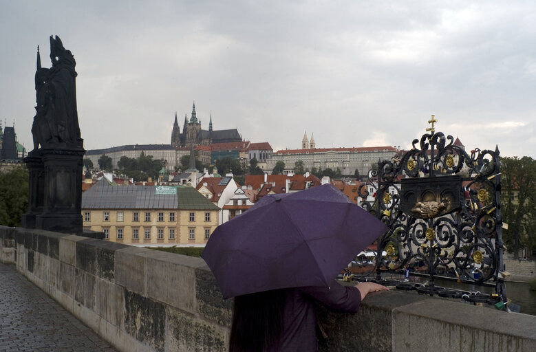 The Charles Bridge (Czech: Karl?Øv most About this sound listen (help¬?info)) is a famous historic bridge that crosses the Vltava river in Prague, Czech Republic. Its construction started in 1357 under the auspices of King Charles IV, and finished in the beginning of the 15th century. As the only means of crossing the river Vltava (Moldau) until 1841, the Charles Bridge was the most important connection between Prague Castle and the city's Old Town and adjacent areas. This solid-land connection made Prague important as a trade route between Eastern and Western Europe. The bridge was originally called the Stone Bridge (Kamenn?? most) or the Prague Bridge (Pra?æsk?? most) but has been the Charles Bridge since 1870.