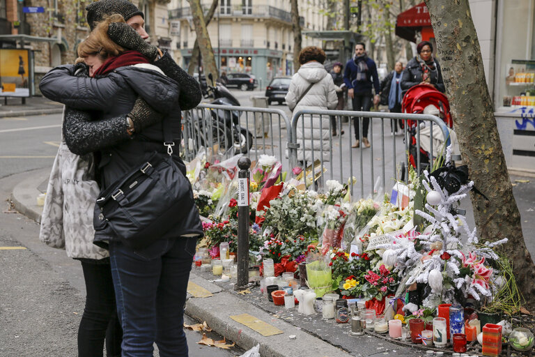 Flowers and mourning scenes in Paris where terrorist attacks took place on November 13, 2015