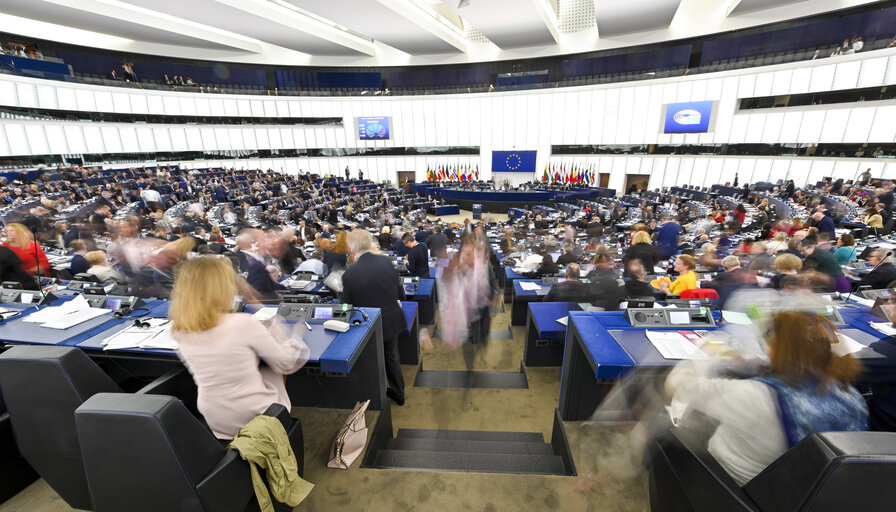 MEPs exit Plenary chamber after voting session.