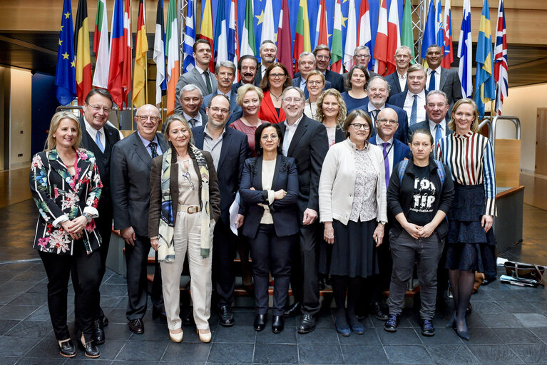 Photo 2: Family picture of the INTA committee with the Commissioner in charge of Trade