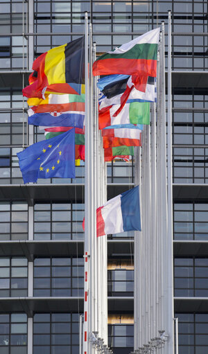 European and French flag at half-mast for the victims of the attack against Charlie Hebdo