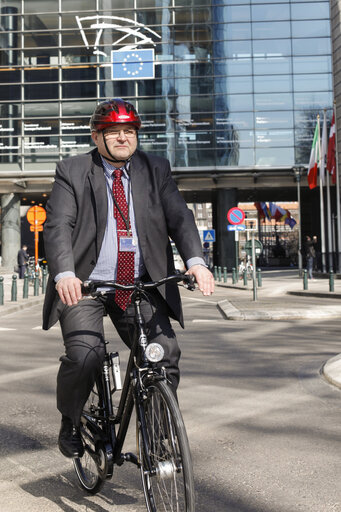 MEP Kent JOHANSSON on a bicycle in front of the European Parliament in Brussels