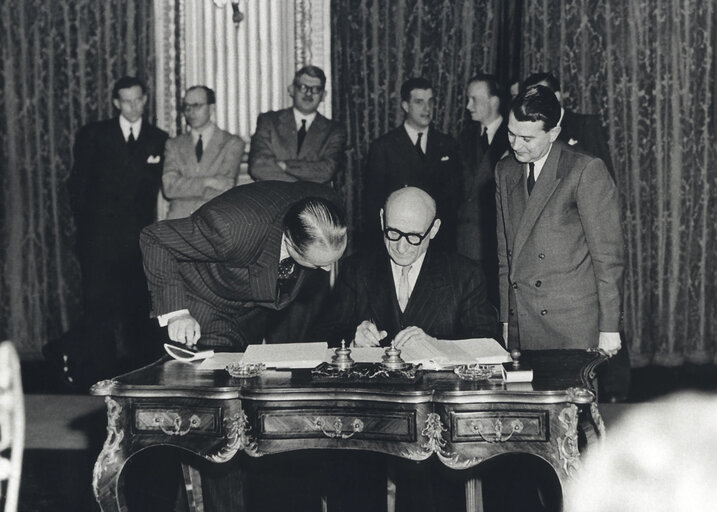 Robert Schuman signs the Paris Treaty in 1951 creating the European Coal and Steel Community (ECSC)