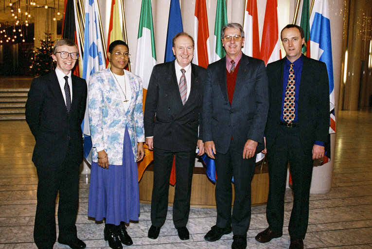 Photo 2: Gordon ADAM with guests in front of flags