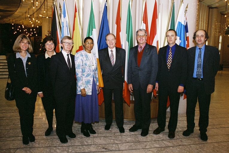 Photo 3: Gordon ADAM with guests in front of flags