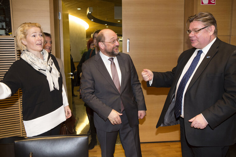 FINLAND, Helsinki: Martin  SCHULZ  (CENTER) greets with Timo SOINI (RIGHT), and Miapetra Kumpula-Natri (LEFT) in meeting room of the Grand Commitee, in Annex building of the Parliament, on March 28, 2014 in Helsinki, Finland.