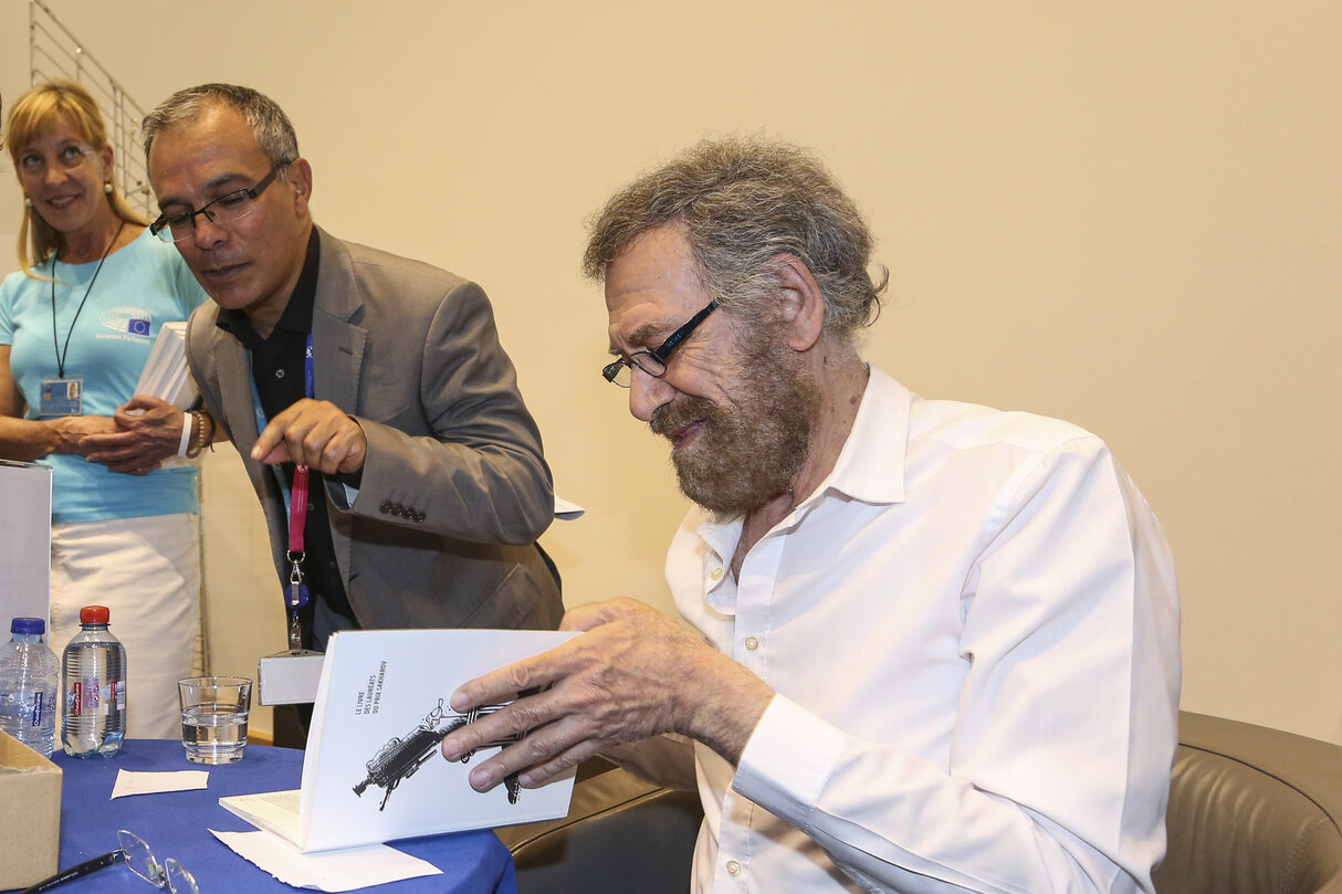 Europe Day 2016 in Brussels. The European Parliament opens its doors to the public.  FERZAT, Ali - 2011Sakharov Prize laureate,  signs books