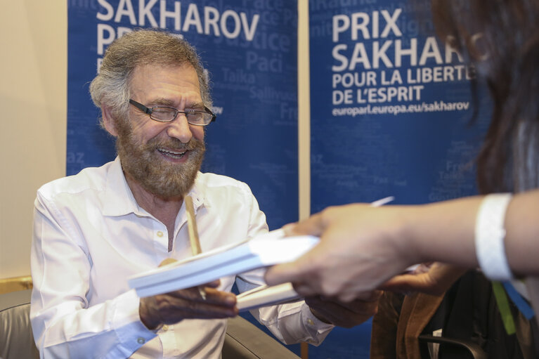 Europe Day 2016 in Brussels. The European Parliament opens its doors to the public.  FERZAT, Ali - 2011Sakharov Prize laureate,  signs books