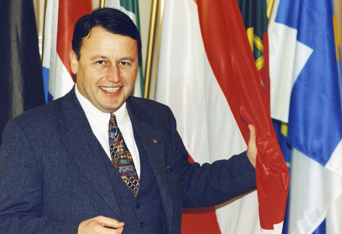 RUBIG Paul in front of some flags of country member of the EU in February 1996