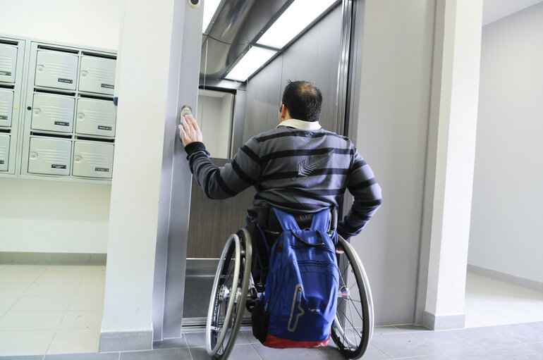 Man in a wheelchair using elevator