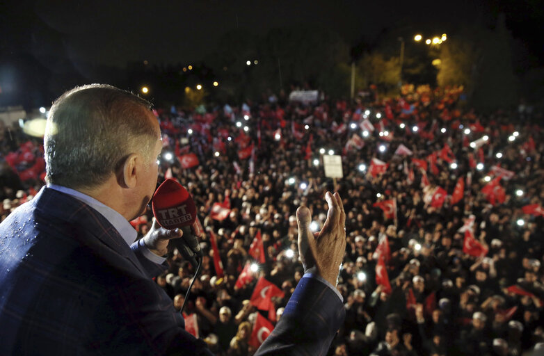 Turkey's President Recep Tayyip Erdogan addresses cheering supporters after unofficial referendum results were announced, in Istanbul, late Sunday, April 16, 2017. Turkey's main opposition Republican People's Party leader Kemal Kilicdaroglu has raised objections to the actions of the country's electoral board in the conduct of Sunday's referendum on whether to expand the powers of the president. (Yasin Bulbul/Presidential Press Service via AP)