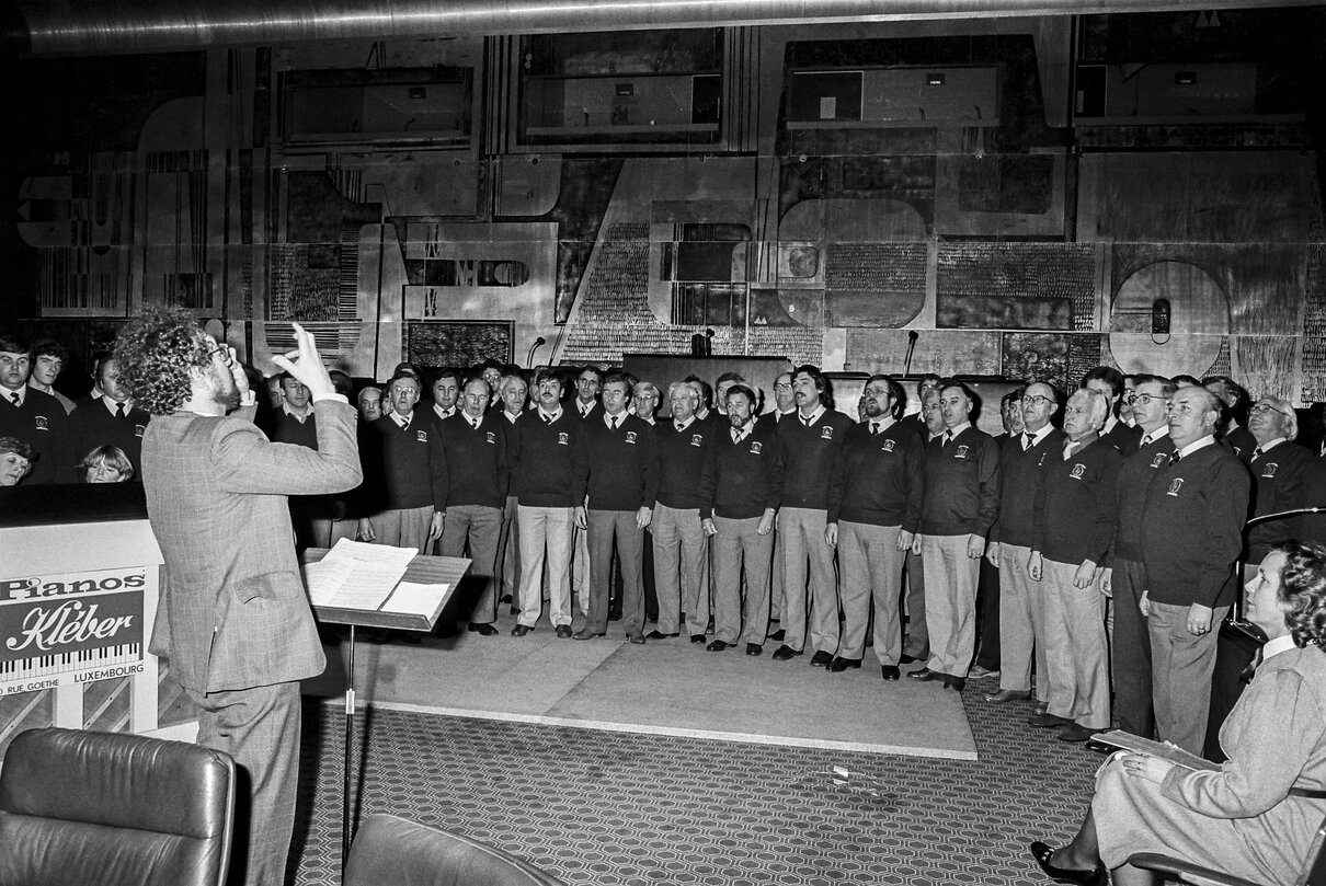 Performance by a male choir at the EP in Luxembourg in April 1985