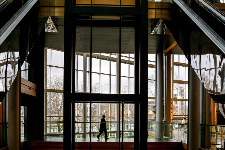 LOW Building - Silhouette of a man walking accross the LOW building
