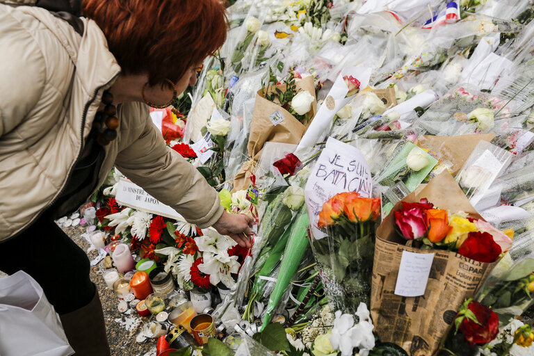 Flowers and mourning scenes in Paris where terrorist attacks took place on November 13, 2015