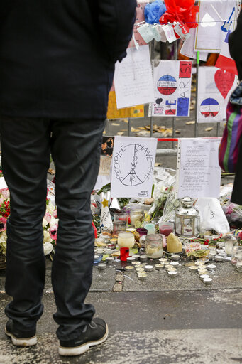 Flowers and mourning scenes in Paris where terrorist attacks took place on November 13, 2015