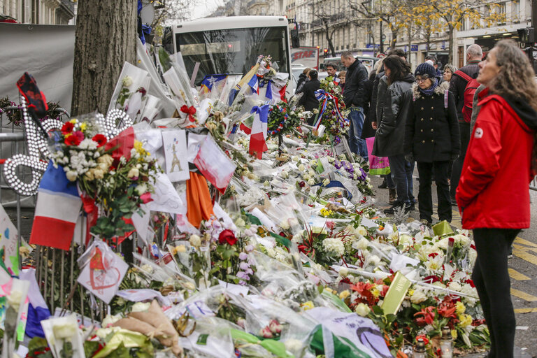 Flowers and mourning scenes in Paris where terrorist attacks took place on November 13, 2015