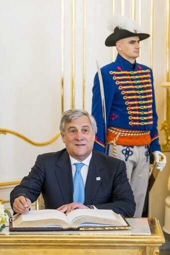 Foto 1: President of the European Parliament Antonio Tajani (R) signs into a guestbook during his meeting with President of Slovak Republic  in Bratislava on April, 24.