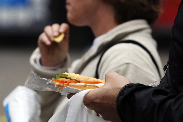 People eat street food in London