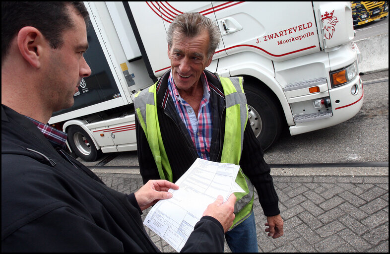 Valokuva 9: Luc Van Dam, 66, a truck driver since 44 years loads foodstuffs in Vlissingen, The Netherlands, to be delivered in northern France.