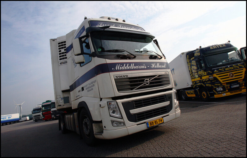 Valokuva 6: Luc Van Dam, 66, a truck driver since 44 years loads foodstuffs in Vlissingen, The Netherlands, to be delivered in northern France.