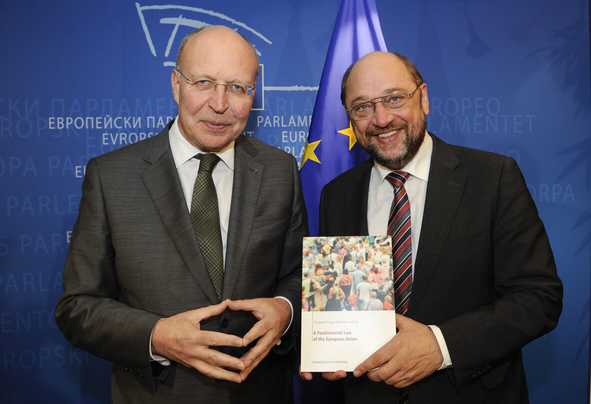 Andrew Duff handing over latest publication of the Spinelli Group; A Fundamental Law of the European Union