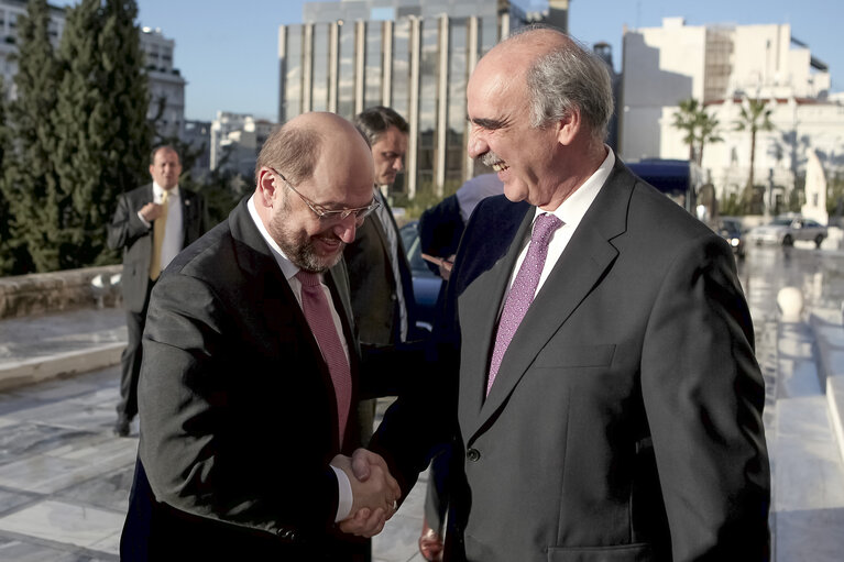 Suriet 1: Greek Chairman of the Parliament Evangelos Meimarakis welcoms President Martin Schulz at Greek Parliament for a meeting, in Athens,Greece on November 26 2013.