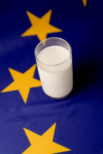 Glass of milk upon a European flag