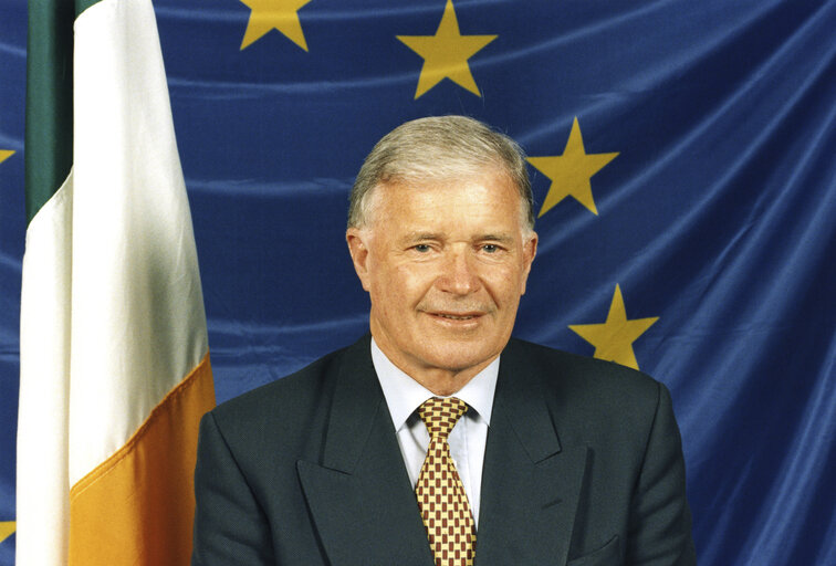 Photo 2: Liam Hyland in front of the Irish and European flag