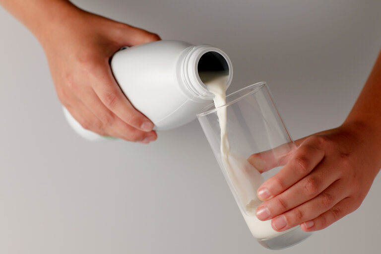 Man pouring milk