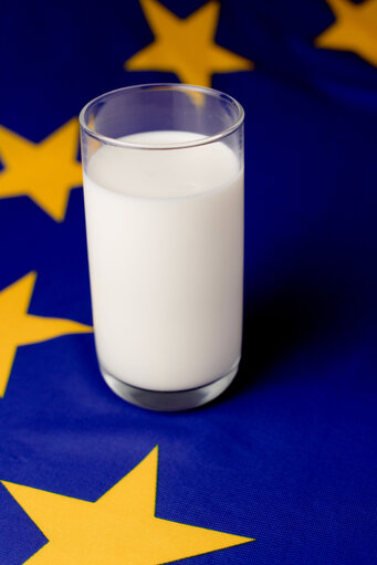 Glass of milk upon a European flag