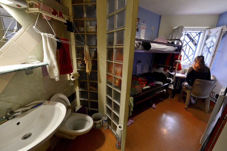 Strasbourg detention centre.  Inmate reading in her  cell.