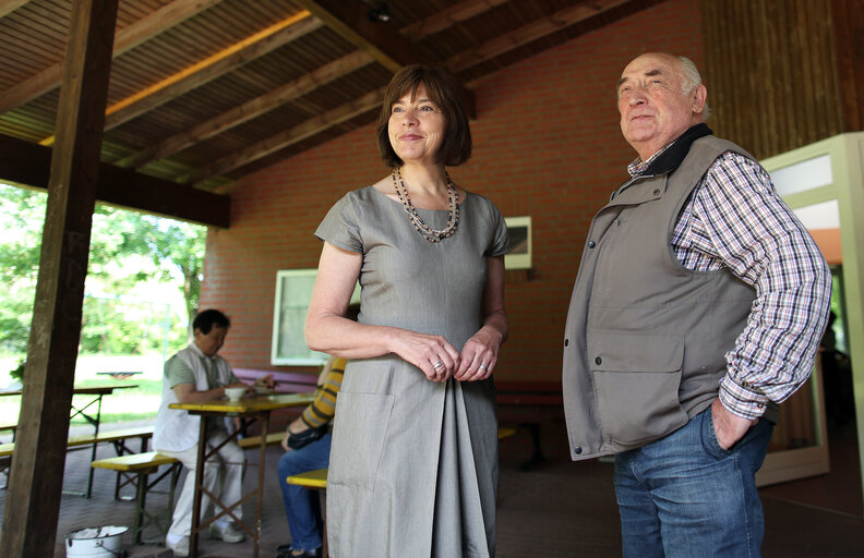 Rebecca  HARMS  (L), member of the European Parliament from German Green Party (Buendnis'90/Die Gruenen) and Candidate for the european elections, speaks with a man outside a polling station before voting for the European parliament elections on May 25, 2014 in Waddeweitz, northern Germany.