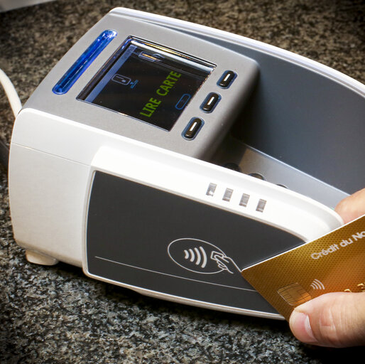 NFC (Near Field Communication) symbol on credit card and payment terminal