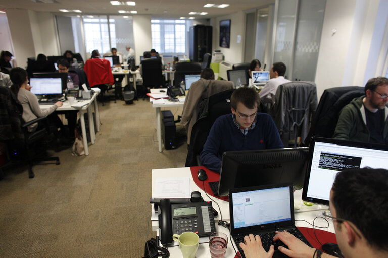 Men and women at work. Staff members are seen at the Easyroommate.com website office  in London