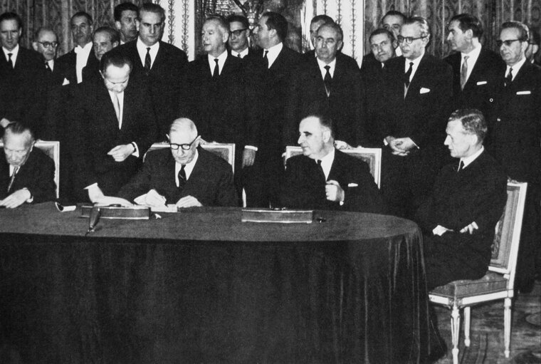 Photo 1: Konrad ADENAUER, Charles de GAULLE sign the Elysée Treaty in Paris, France. January 22, 1963