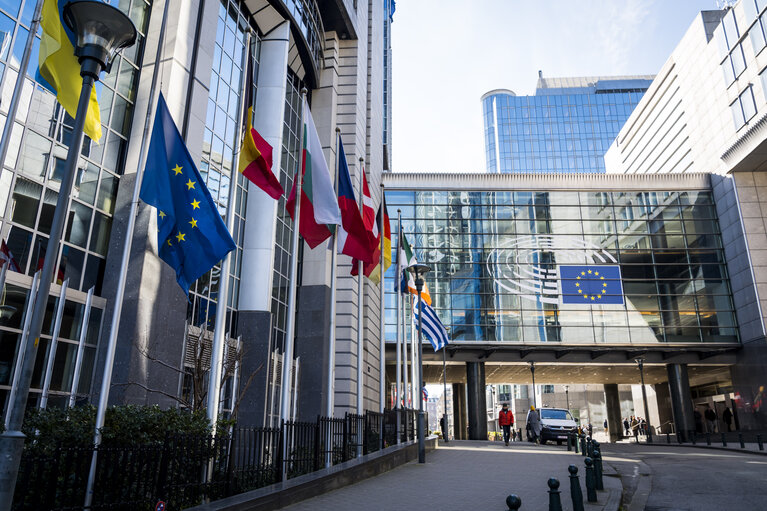 EU and Greek flags at half mast at the EP building in Brussels, in solidarity with the victims of a train crash in Greece