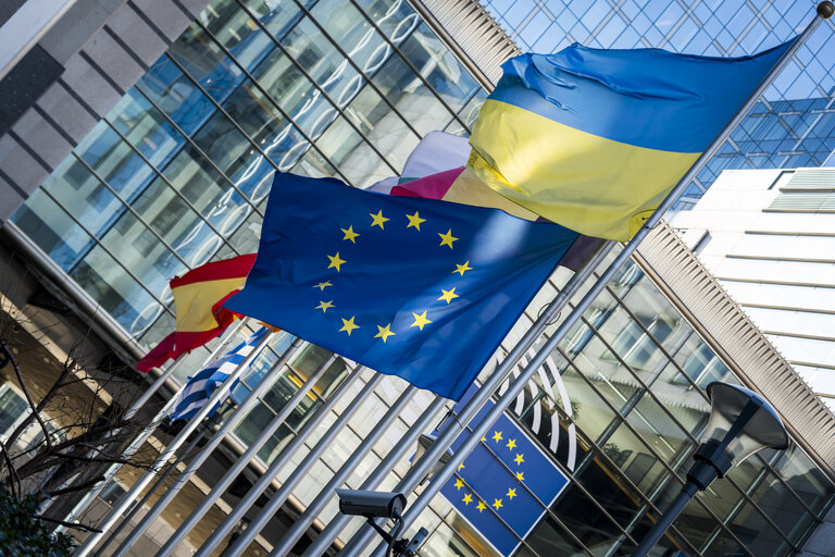EU and Greek flags at half mast at the EP building in Brussels, in solidarity with the victims of a train crash in Greece