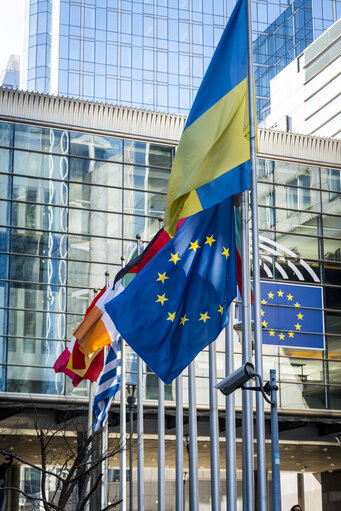 EU and Greek flags at half mast at the EP building in Brussels, in solidarity with the victims of a train crash in Greece