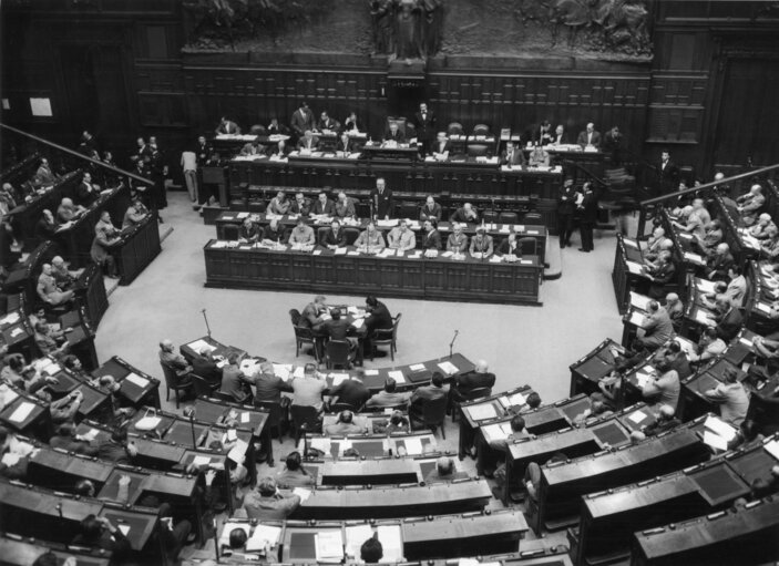 Former Prime Minister of Italy Giuseppe Pella stands, center, in front of Giovanni Leone, President of the Chamber of Depuities, and speaks on Euratom and the Common Market, during discussions in the Chamber of Deputies, in Rome, July 28, 1957. (AP Photo/Atenni)